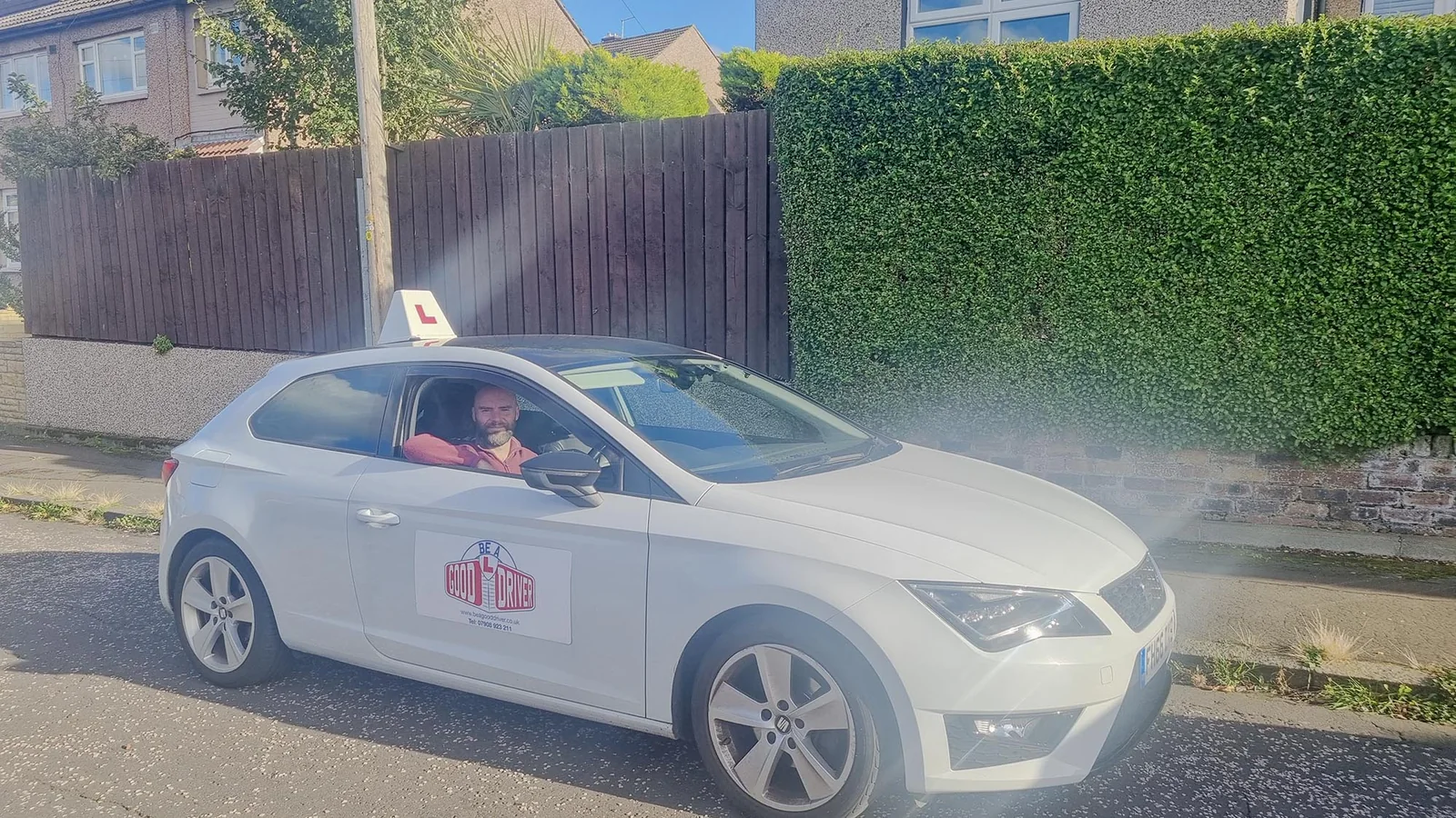 Adrian Palmer sitting in a car